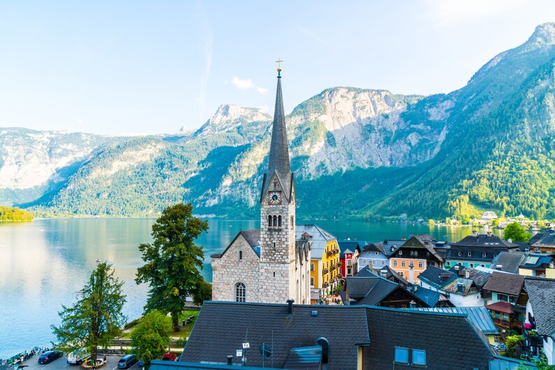 https://guideupstudyabroad.com/wp-content/uploads/2025/05/freepicdownloader.com-hallstatt-village-hallstatter-lake-austrian-alps-medium.jpg